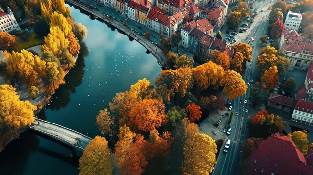 Aerial view of Maribor showing fall colors and serene river with historic architecture, Aerial view of the city Maribor in Slovenia on a sunny autumn day