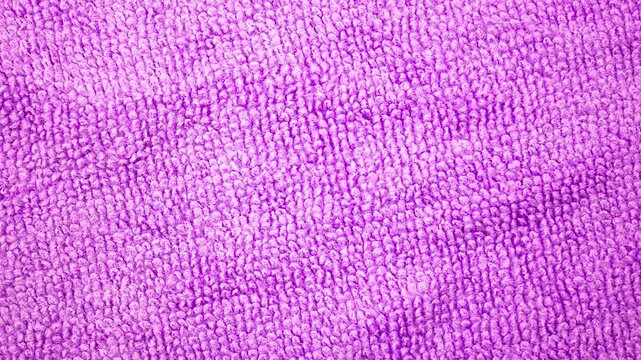 Authentic texture of microfiber, cloth, rag. Purple cloth background, surface dusting material,animation.