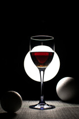 Still life with wine glass and foam balls	