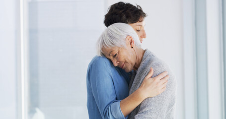 Emotional, comfort and woman hugging senior mother in retirement home for grief, support or loss....