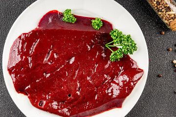 Raw liver beef veal meat steak liver grill appetizer vegetables dish fresh delicious gourmet food...