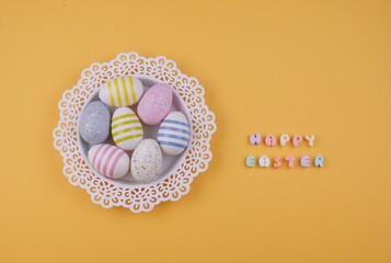 A white lace doily holds colorful Easter eggs with 