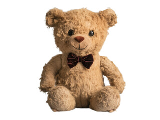 Obraz premium Soft caramel-brown teddy bear with a velvet bowtie, embroidered eyes, and a textured faux-fur body, sitting upright.