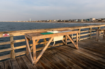 A fish cleaning station with a sink overlooks the Atlantic Ocean on Oak Island Pier in North Carolina.