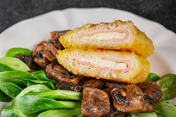 Cordon Bleu Cutlet meat chicken, ham, cheese appetizer dish fresh delicious gourmet food background on the table rustic food top view copy space