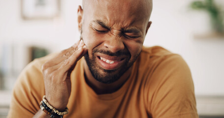 Toothache, sensitive and man in house with dental problem for cavity, gum disease or gingivitis....