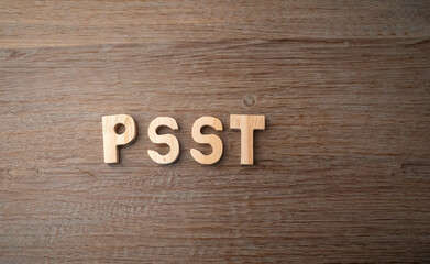 Fototapeta premium Fun, hey, psst expressions to get someone's attention written in wooden letters with a textured background