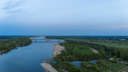 River with a bridge and a town in the background