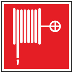 White fire hose reel sign on red background indicating location of firefighting equipment for building safety and fire prevention