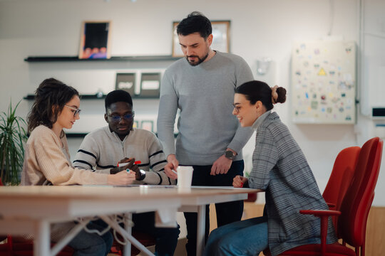 Marketing team working on project in modern office