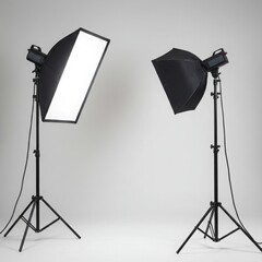 Two studio lights with softboxes positioned in a photography setup isolated on gray background
