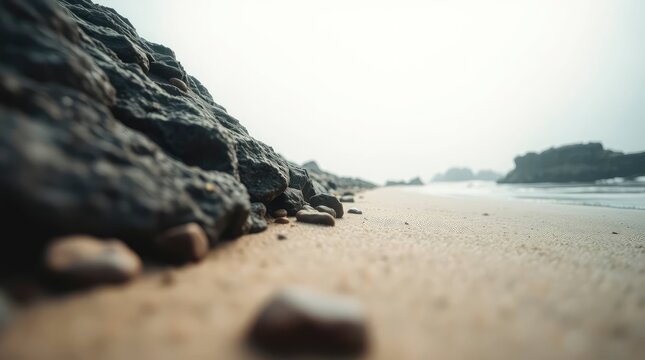 Coastal Rocks and Sandy Beach: A Serene Minimalist Seascape