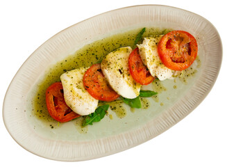 Appetizing caprese salad with mozzarella served with arugula on platter. Isolated over white background