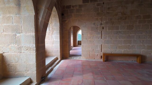 Large hall with stone arches in medieval style in the old town of Valderrobres, Teruel.