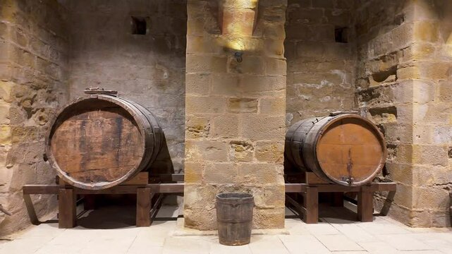 Very old cellars in storage with stone arches and old wooden vats. Teruel, Spain.