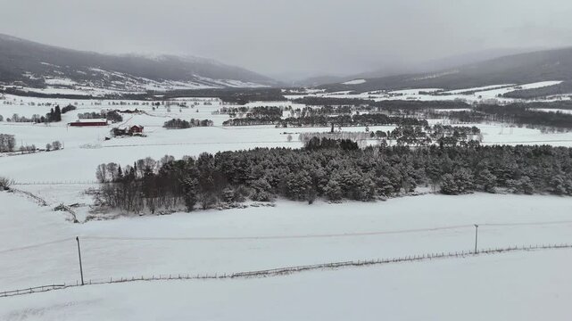 Aerial view of a snow-covered rural landscape in Lesja near Dombas, southern Norway