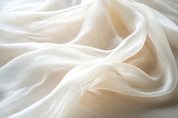 Fototapeta premium Draped off-white sheer fabric with soft folds and gentle texture.