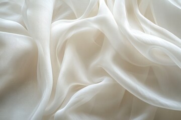 Obraz premium Draped ivory fabric, sheer and translucent, exhibiting delicate folds and soft textures.