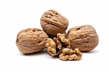Whole cracked walnuts brown shells and textured nut interior isolated on a white background for food photography