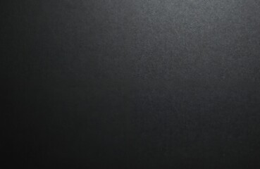 Black paper sheet texture cardboard background. Blank page. Dark abstract backdrop. Textured material for design. Grunge surface backdrop with rough details. Eco-friendly reusing, recycled materials
