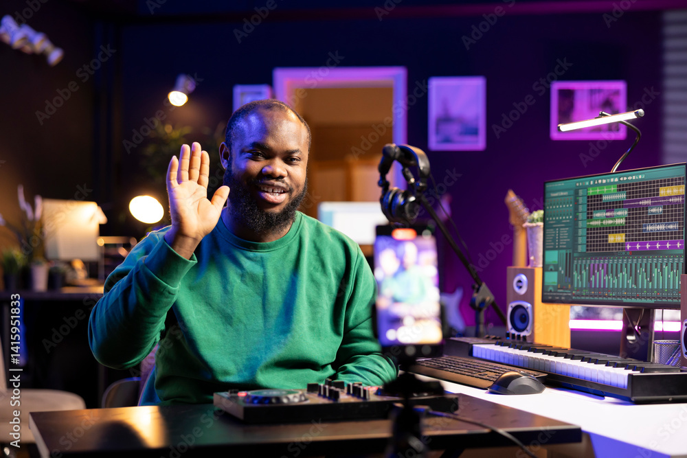 Poster Skilled audio engineer teaching online mixing tunes lessons by using a smartphone on tripod to record himself in home studio. Producer hosting a master class with soundboard console gear.