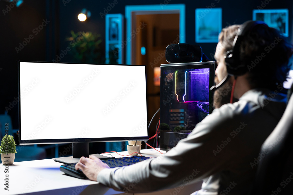 Poster man using gaming station mockup monitor, excited to finally relax by playing videogame on pc at comp