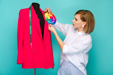 fashion designer analyzes bold pink jacket using color wheel for effective styling. woman...
