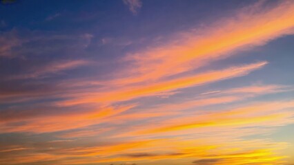 Fototapeta premium Sky meets mountains in a tranquil sunset.