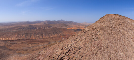 Dramatic aerial image of Montana Escanfraga and the volcanic mountain landscape and coastline near Villaverde in Fuerteventura Canary Islands Spain	