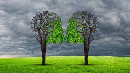 Love Therapy and relationship recovery counseling concept as two empty trees shaped as a human head attracted together as a devoted loving couple with kissing lips for a healthy passionate relation.