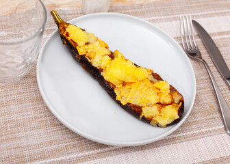 Worldwide popular dish is stuffed eggplant, with cheese baked on top. Close-up image