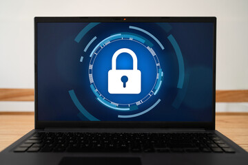 Concept of digital privacy. Laptop with lock icon on screen.