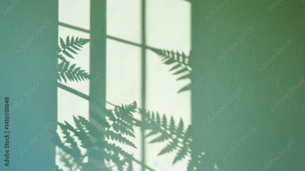 Poster a green wall with a window and a shadow of a leafy plant. the shadow is cast on the wall, creating a