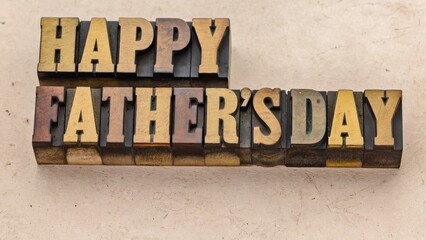 Celebrate Father's Day with a personalized sign made from wooden letter blocks, featuring the greeting 'Happy Fathers Day' in a handwritten style.