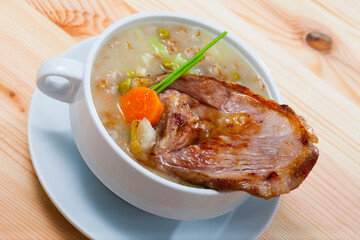 Scottish cuisine. National thick soup with lamb meat, root vegetables, pulses and barley..