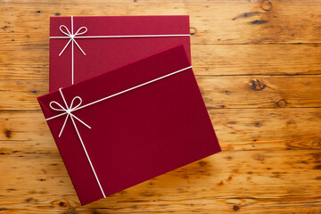 Red Gift Boxs set on Wooden Table.Gifts for Mothers Day, Birthday, Christmas.Festively Wrapped Gift...