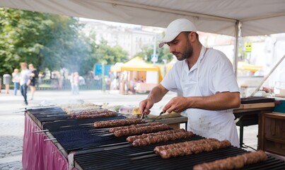 A chef prepares kebabs on the grill and serves them to festival goers. Generative AI
