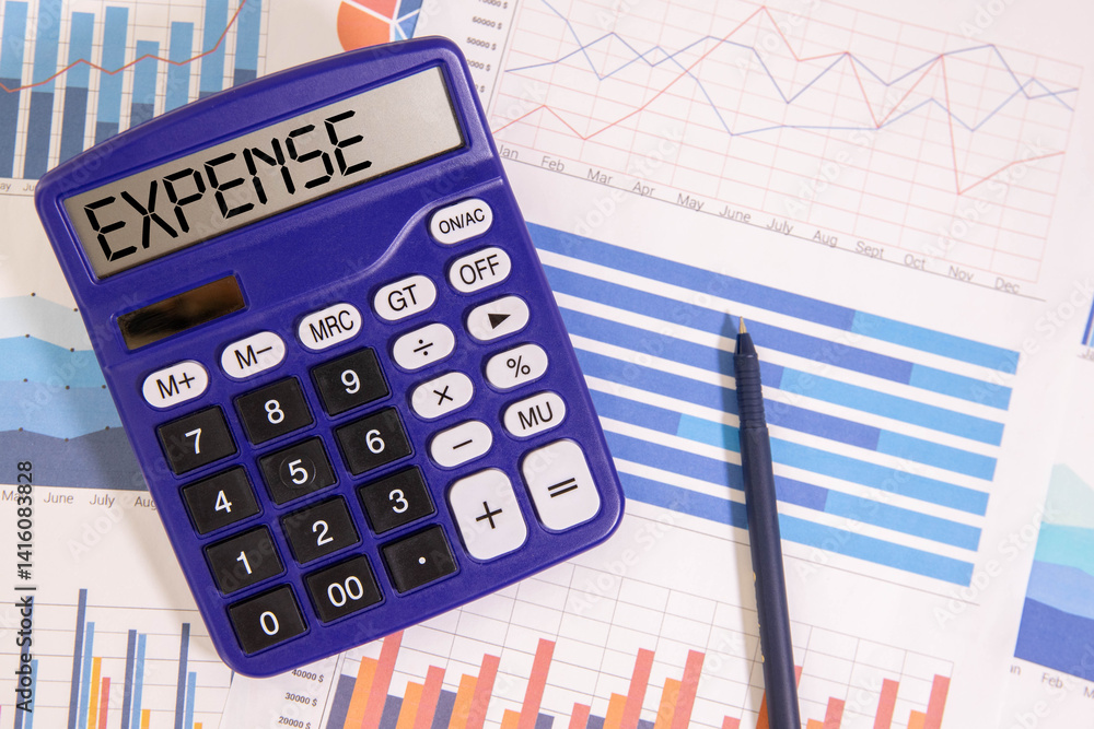 Aufkleber expenses text concept on sheet with notepad and calculator.