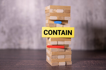 word CONTAIN on wooden block.