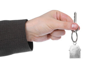 Real estate agent holding key with house shaped keychain on white background, closeup