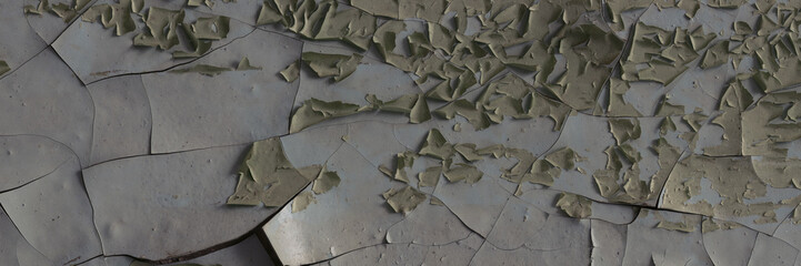 Peeling paint on the wall. Panorama of a concrete wall with old cracked flaking paint. Weathered...