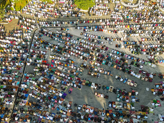 The Muslim community in Garut Regency, Indonesia, together performs Eid prayers in the courtyard of...