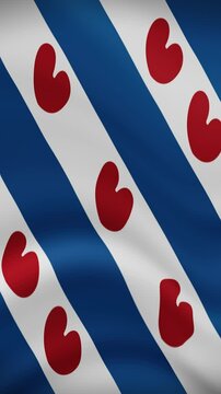 Frisian Waving Flag in Vertical Orientation. Realistic Flag Animation. Seamless Loop Background.