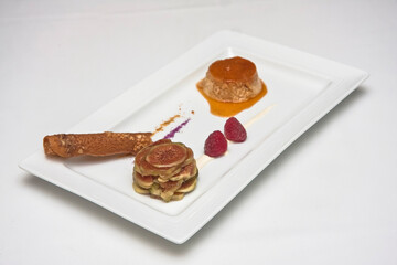 Flan with figs and raspberries, fig and raspberry dessert with caramel on a white background