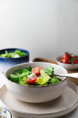 Greek salad with fresh tomatoes, cucumbers, lettuce, feta cheese and seeds.