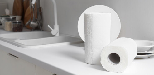 Rolls of paper towels on counter in kitchen, closeup
