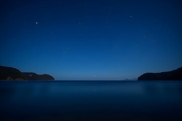 Starry Night Sky Above a Quiet Ocean Bay