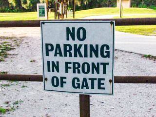 No Parking In Front Of Gate Metal Sign