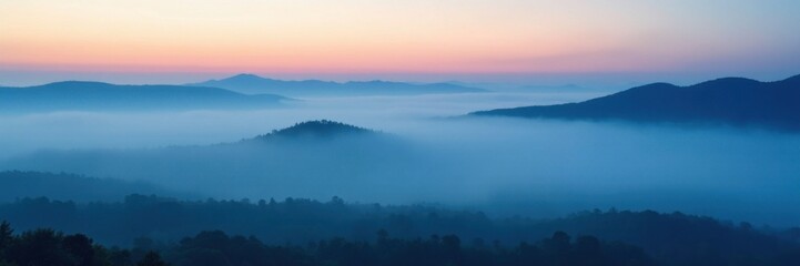 Fototapeta premium Misty morning fog rolling over a vast expanse of deep indigo blue landscape, landscape, fog