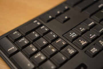 Close-up of a functional black computer keyboard for office tasks